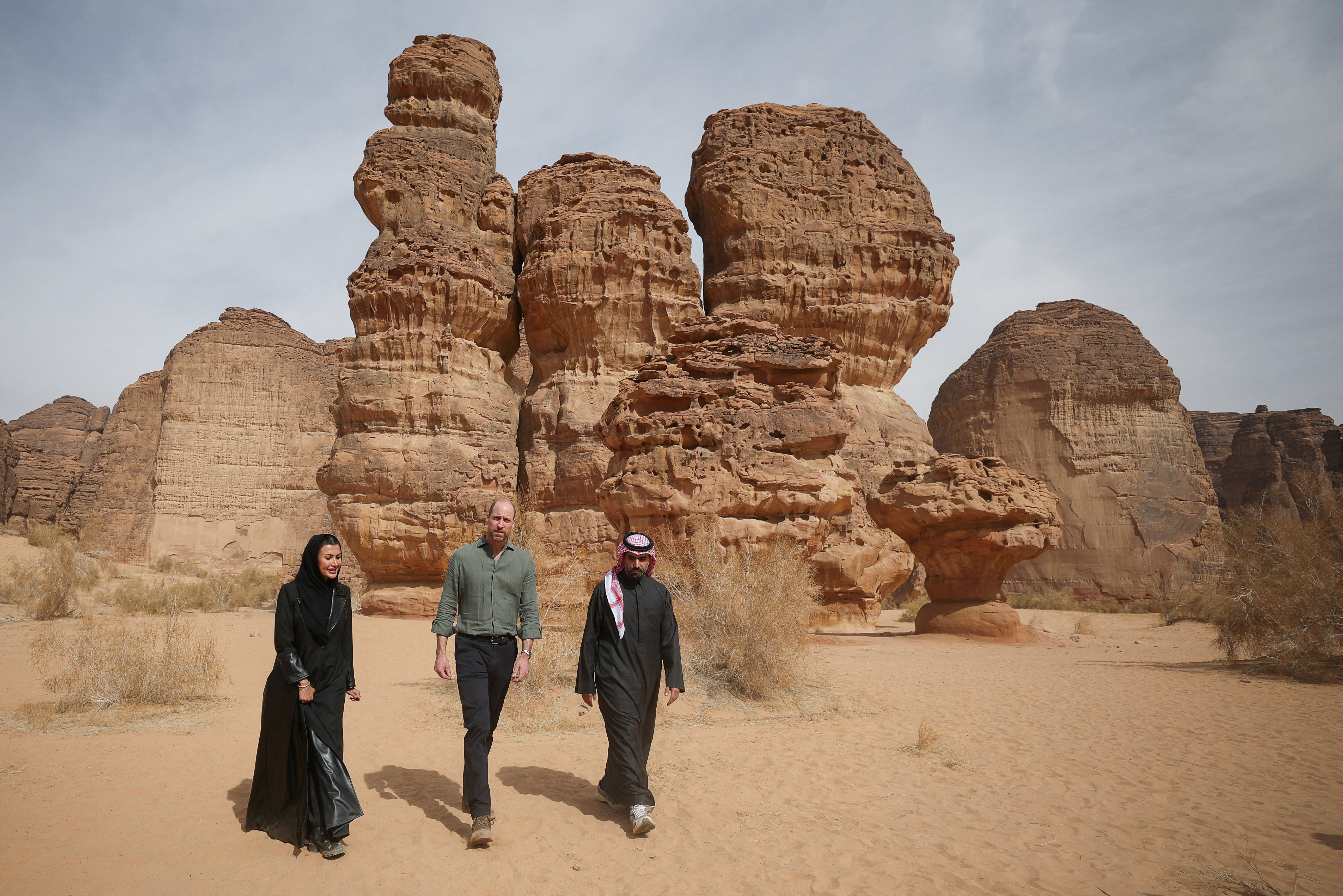 Prince William walks with Saudi Prince Badr bin Abdullah bin Farhan Al Saud and Abeer Al Akel in Sharaan Nature Reserve.