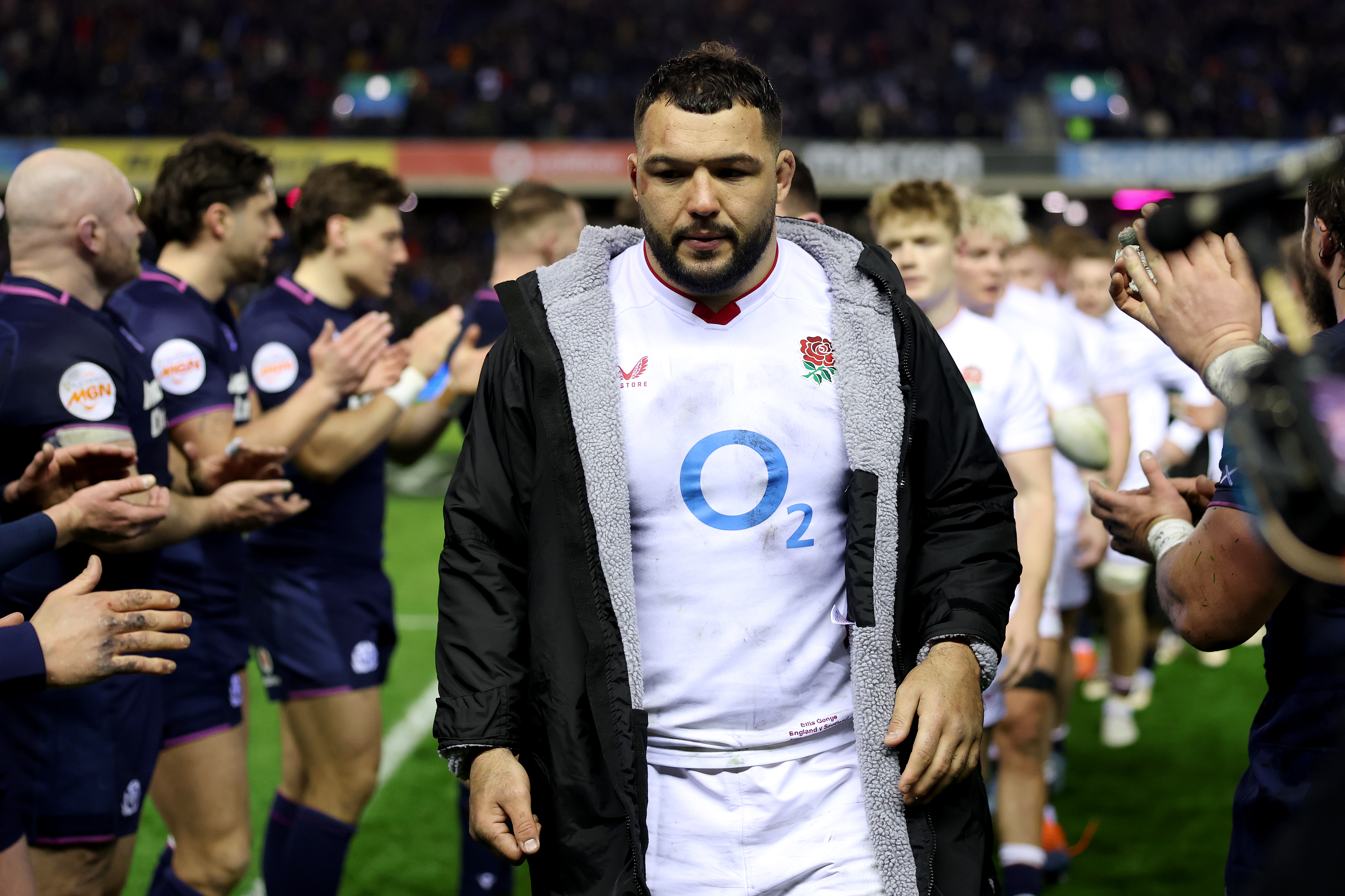 Ellis Genge of England walks off the pitch looking dejected.