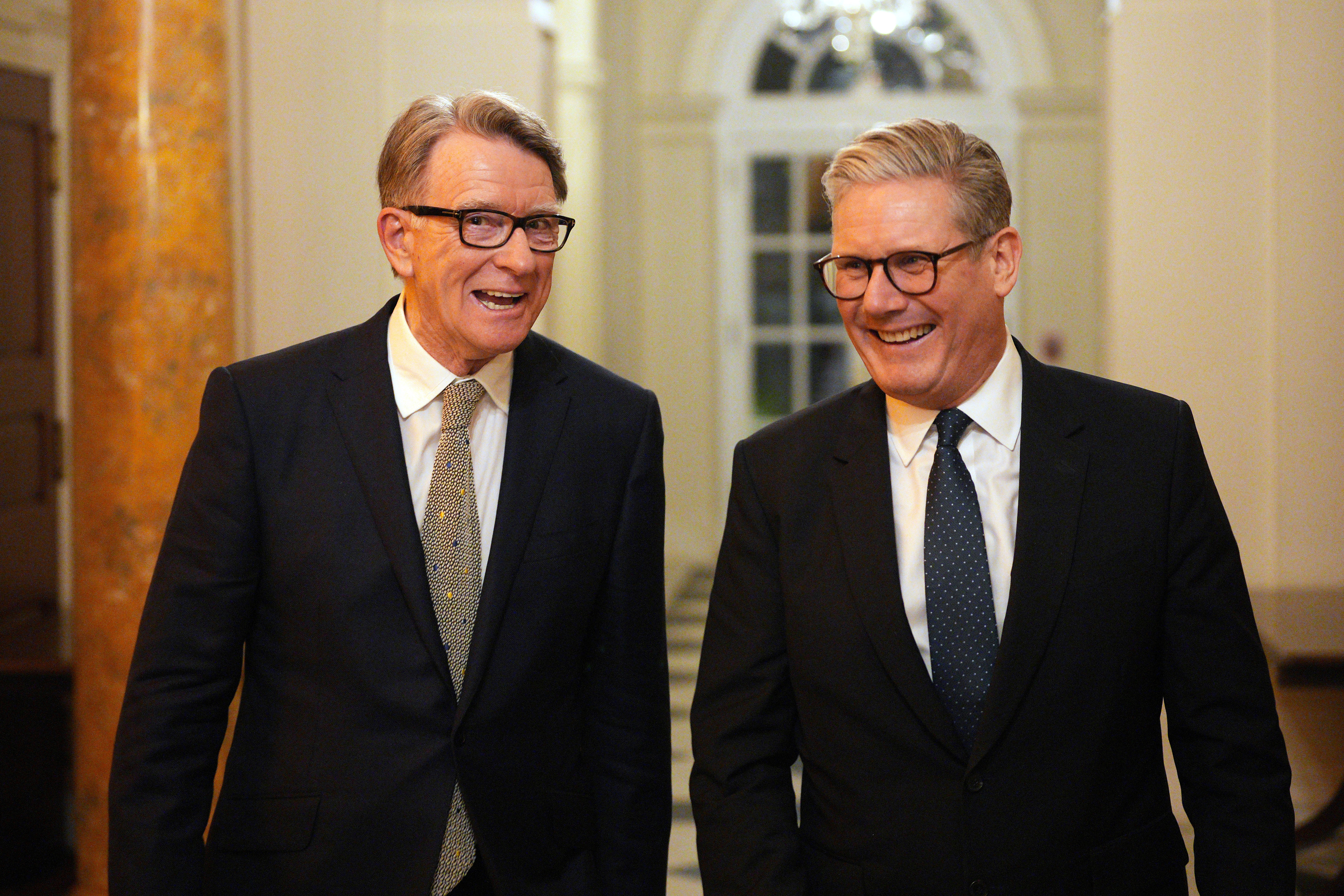 British Prime Minister Keir Starmer and Peter Mandelson talk at a reception in Washington.
