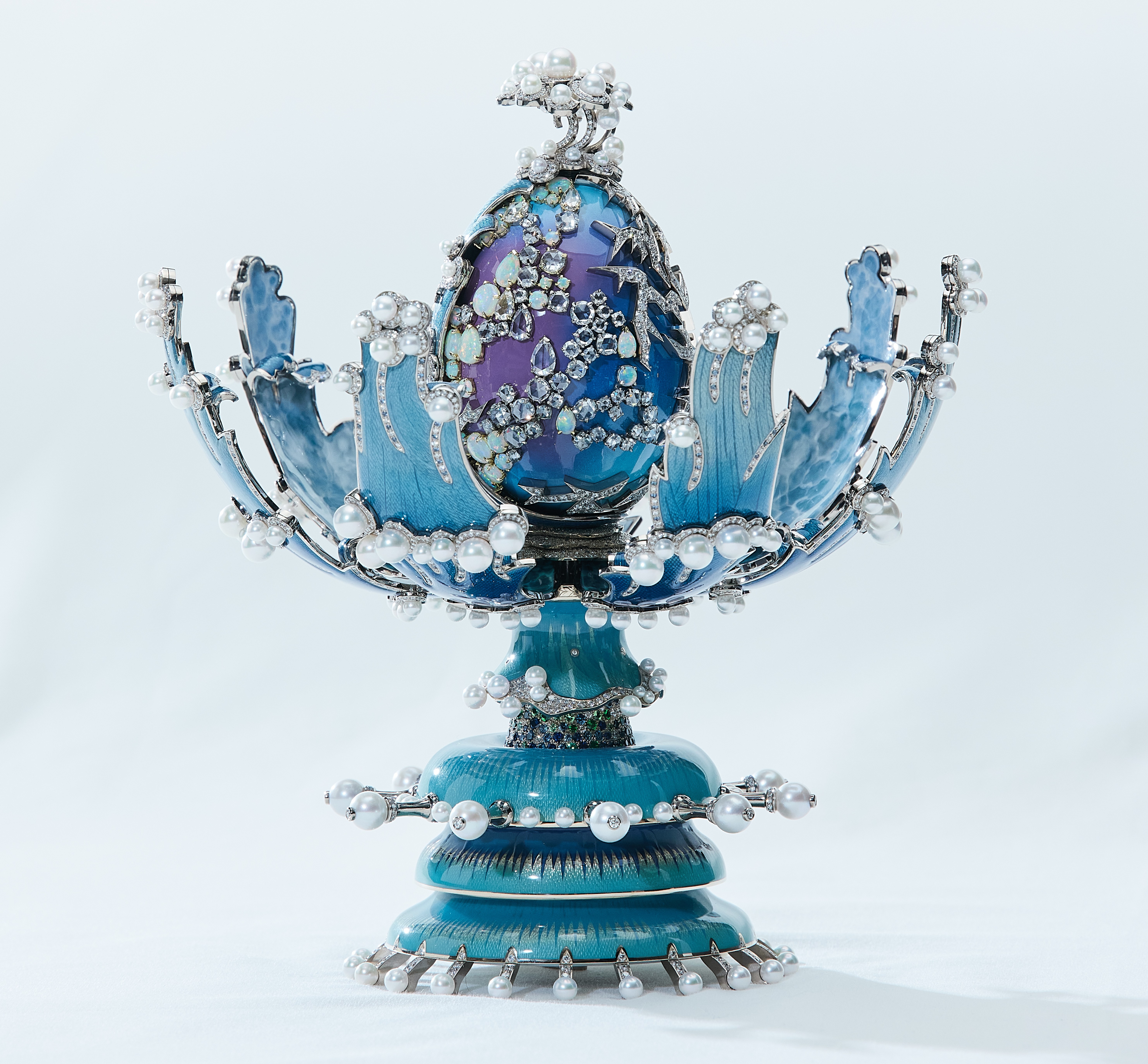 The Regal Splendor Fabergé egg, a lavish blue egg with purple accents, encrusted with opals, diamonds, and pearls.