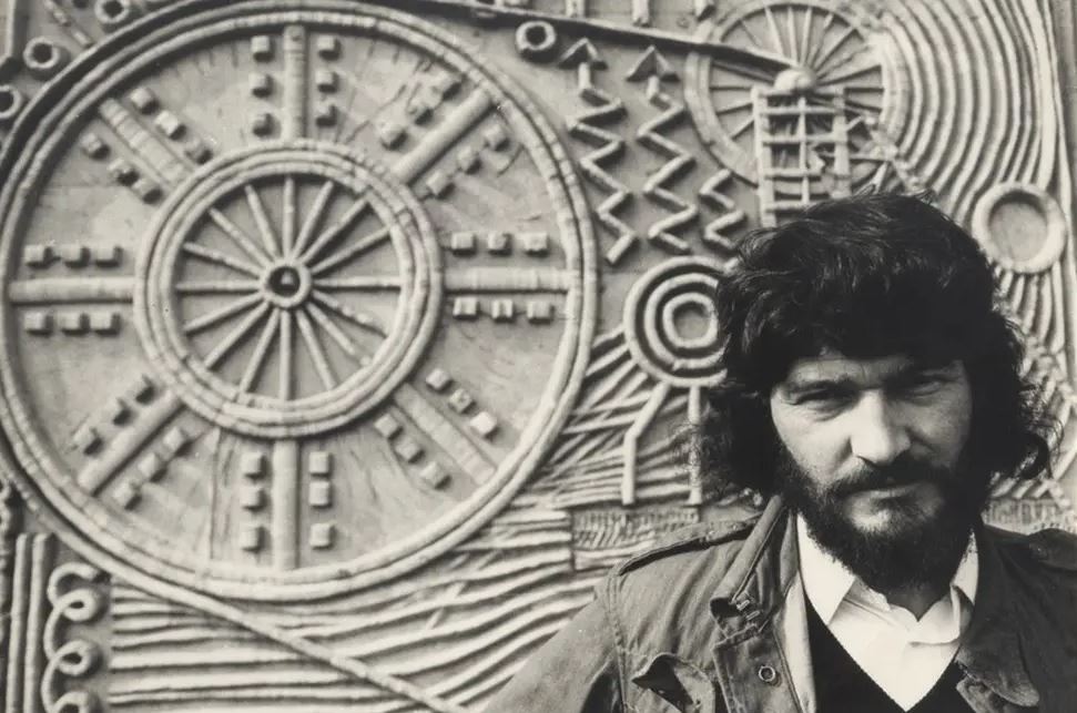 David Harding beside his work "Industry."