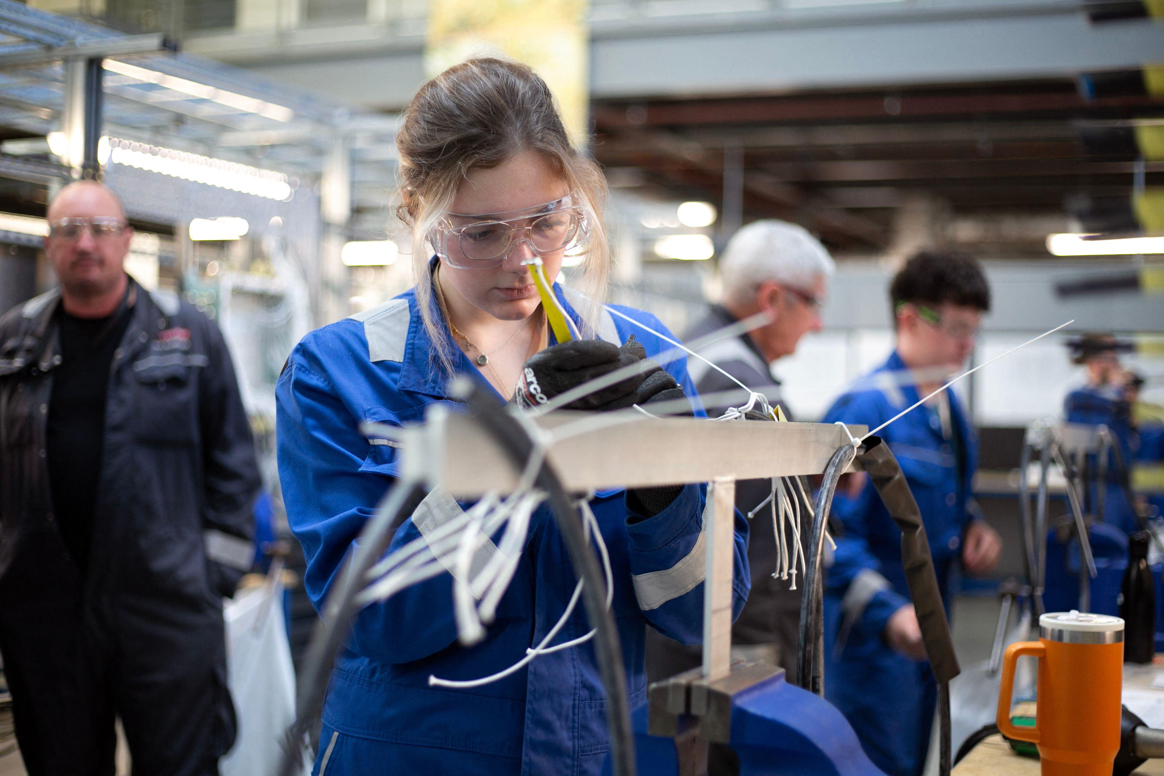 An electrician apprentice at BAE Systems Academy for Skills and Knowledge (SASK) in Barrow-in-Furness, England.