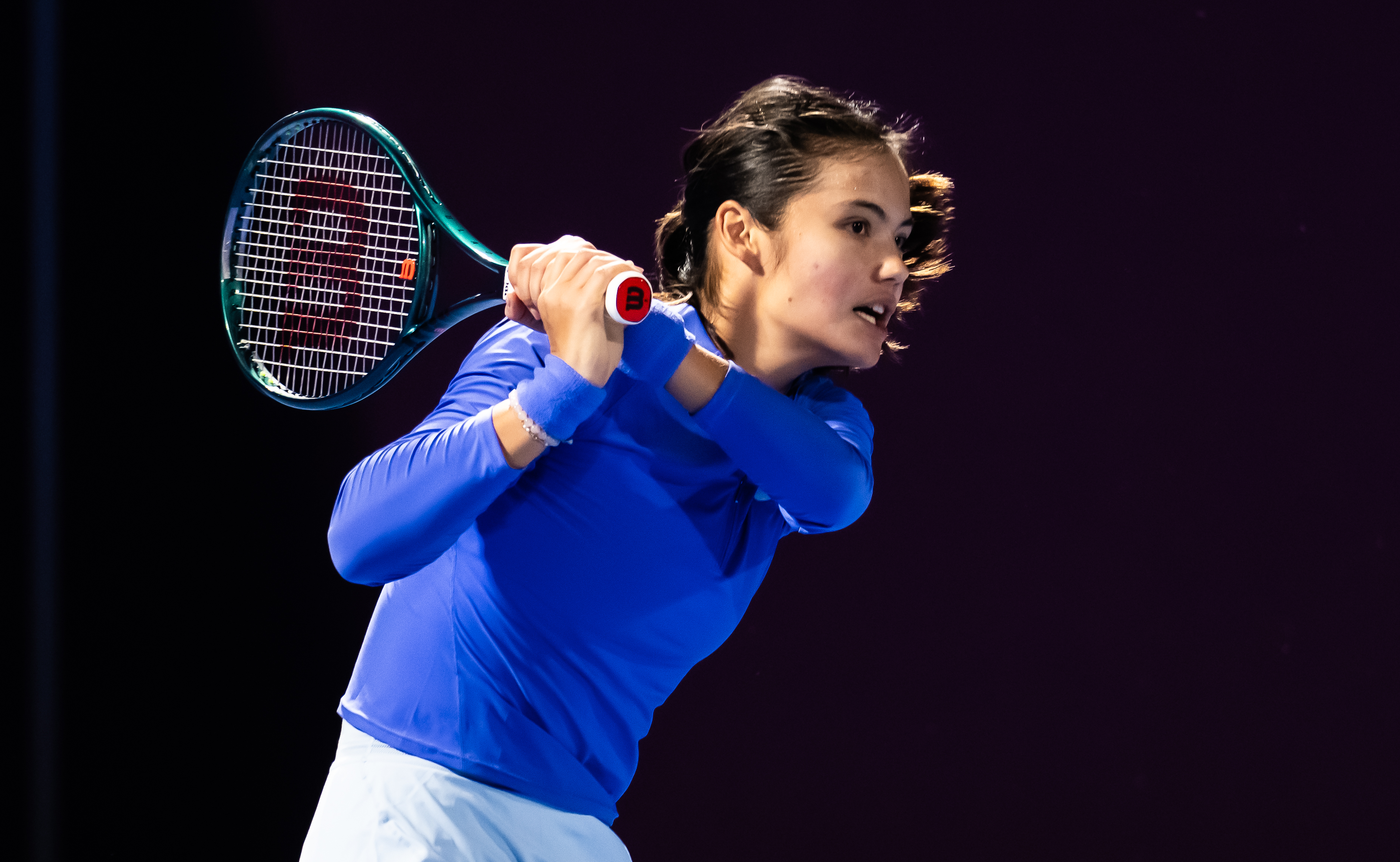 Emma Raducanu playing tennis at the Qatar TotalEnergies Open.