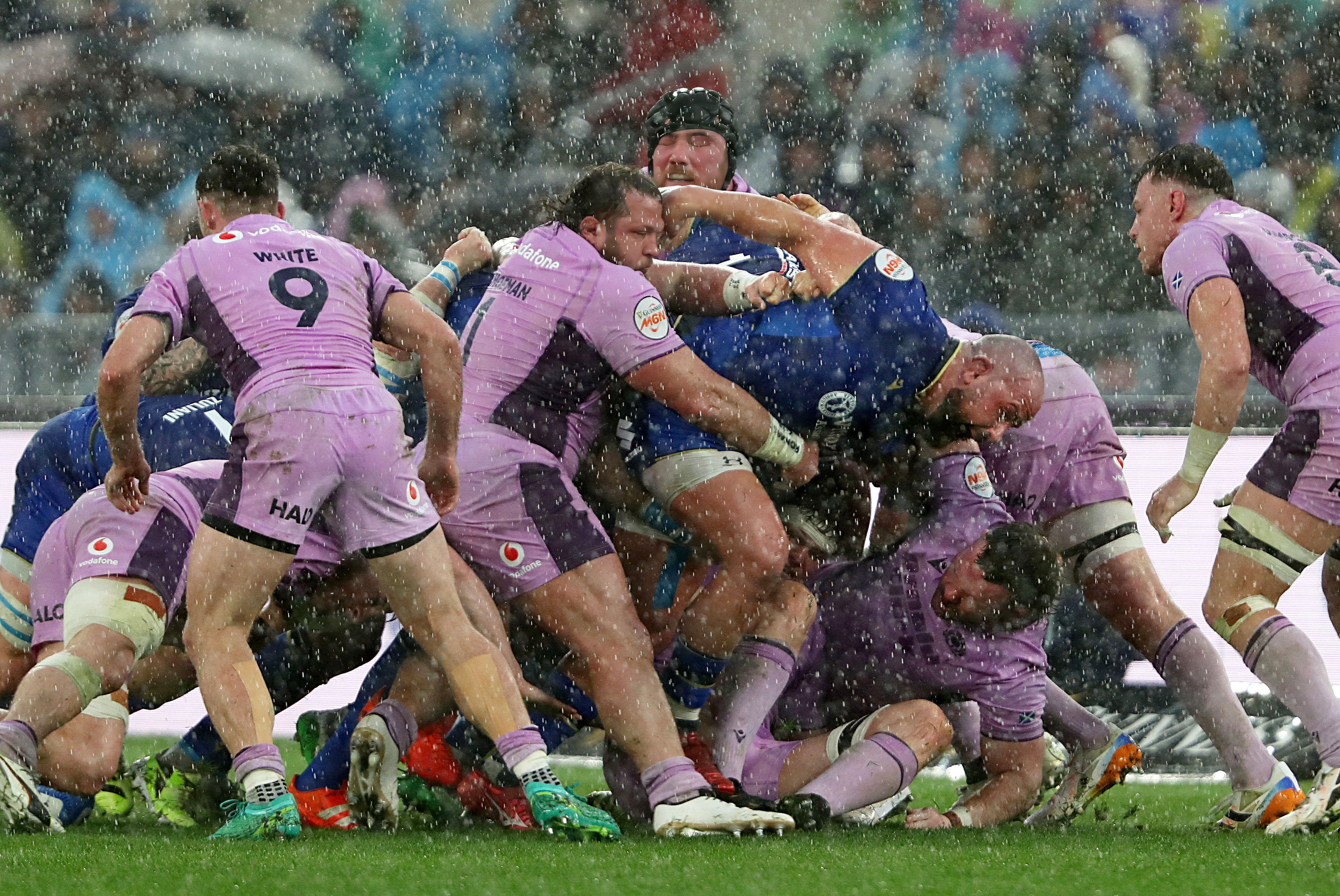 Italy's rugby forwards disintegrate the Scotland scrum with a powerful eight-man drive.