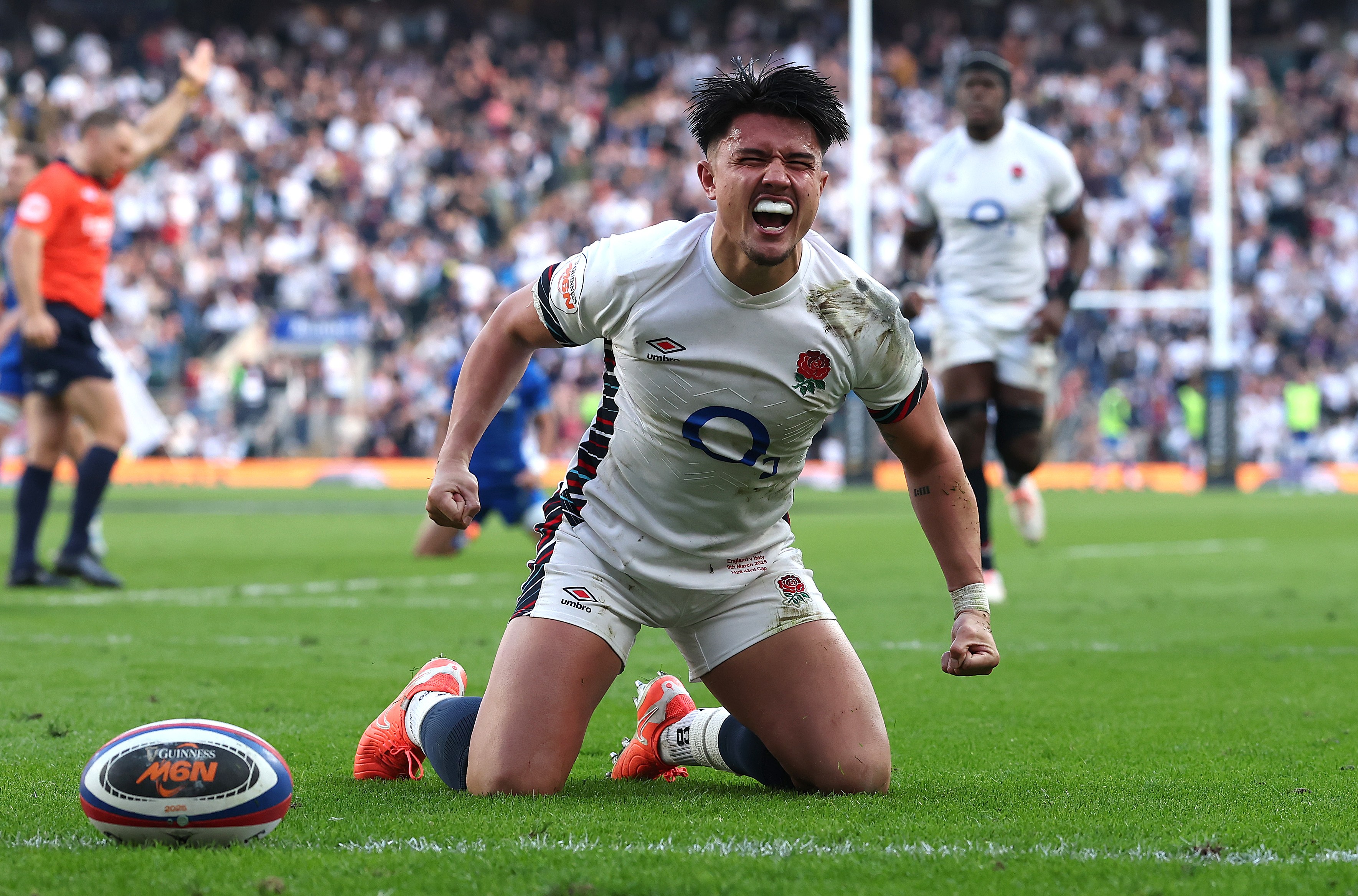 Marcus Smith of England celebrates after scoring a try against Italy.