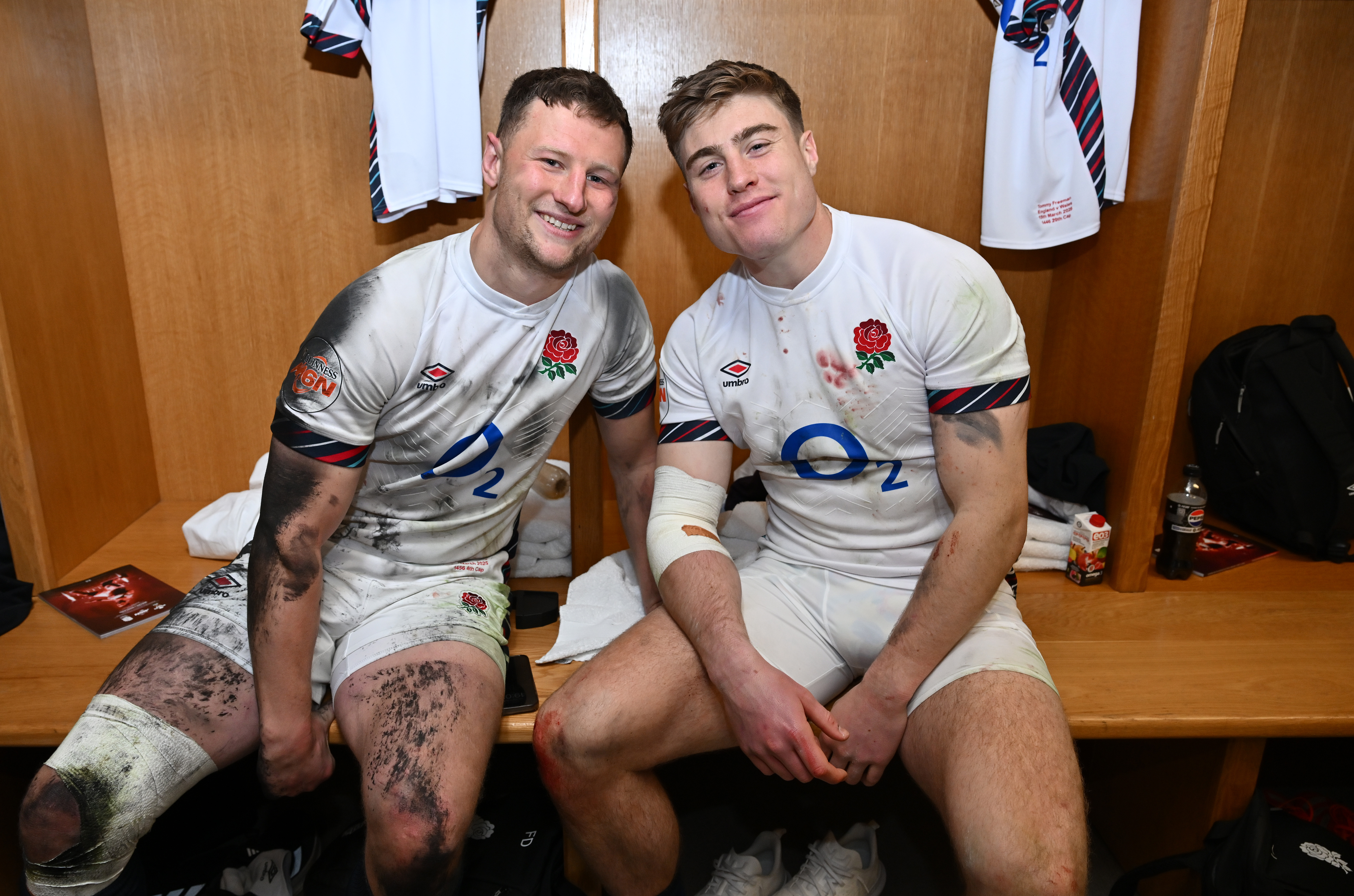 Fraser Dingwall and Tommy Freeman celebrating in the England dressing room after the Guinness Six Nations 2025 match.