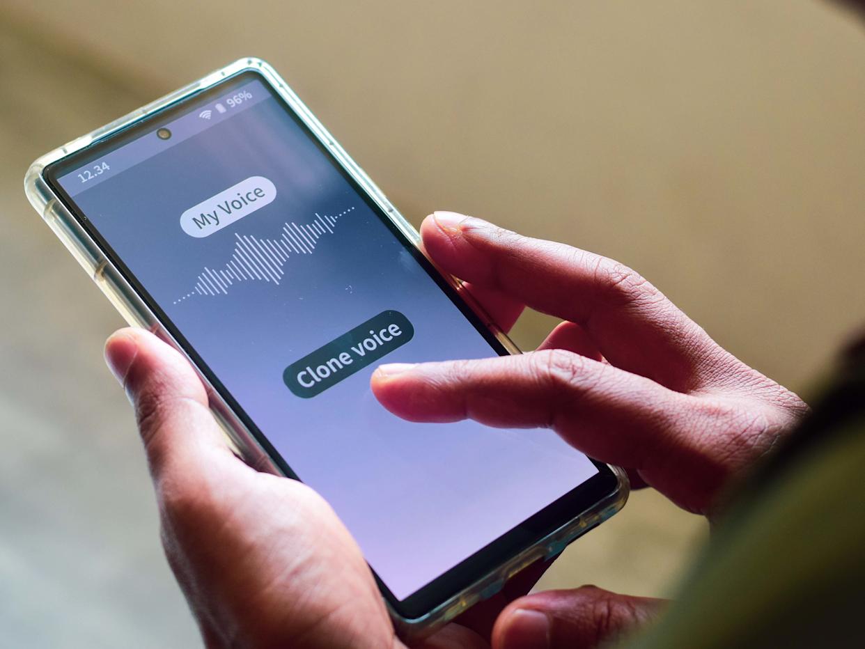 Man using mobile applications for cloning his voice. Selective focus.