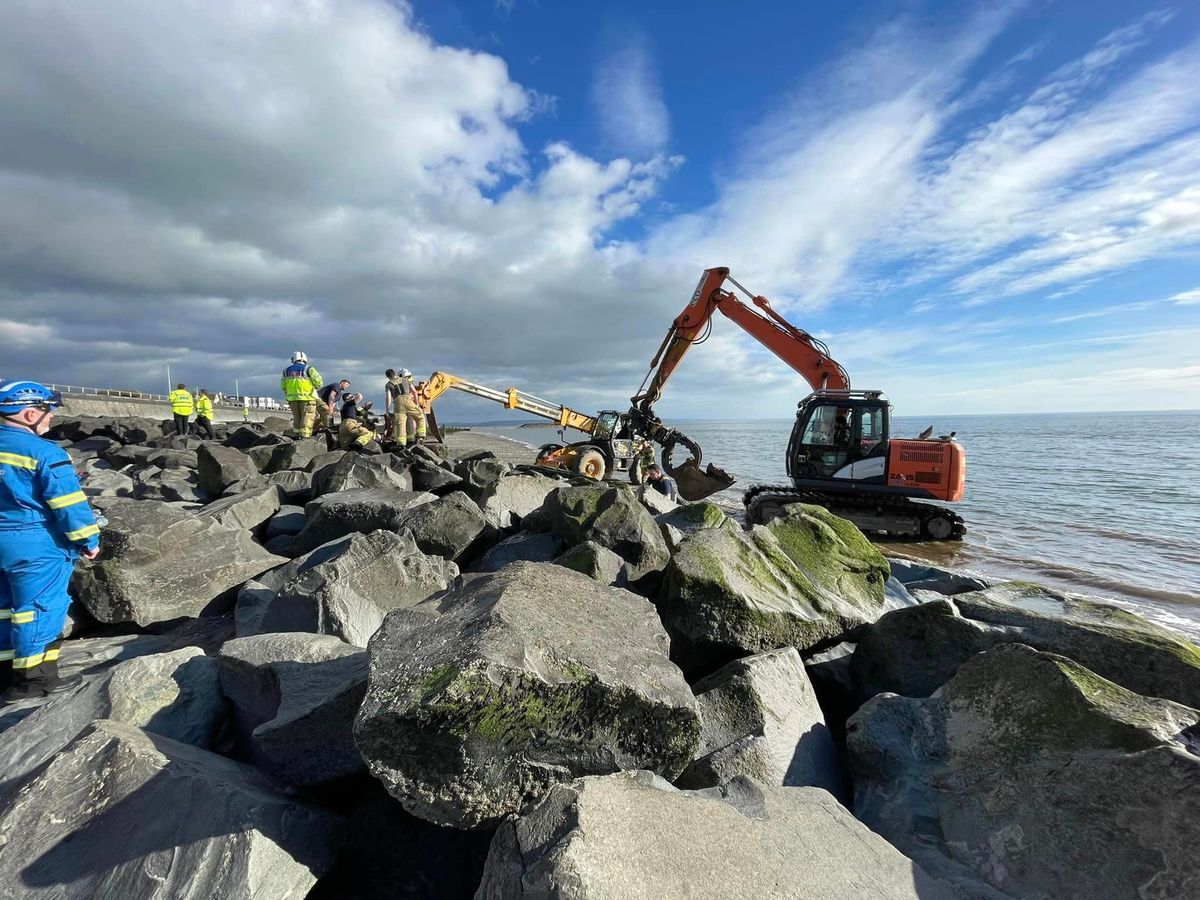 An incoming tide was perilously close to rock armour in Tywyn when a trapped girl was freed after a three-hour rescue operation