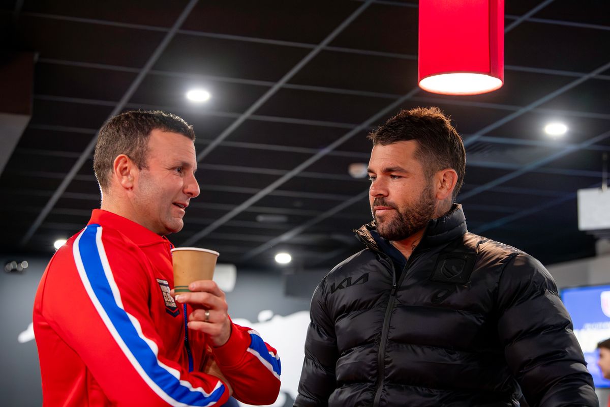 Hull KR coach Willie Peters talks with Brisbane Broncos captain Adam Reynolds at the World Club Challenge media launch.