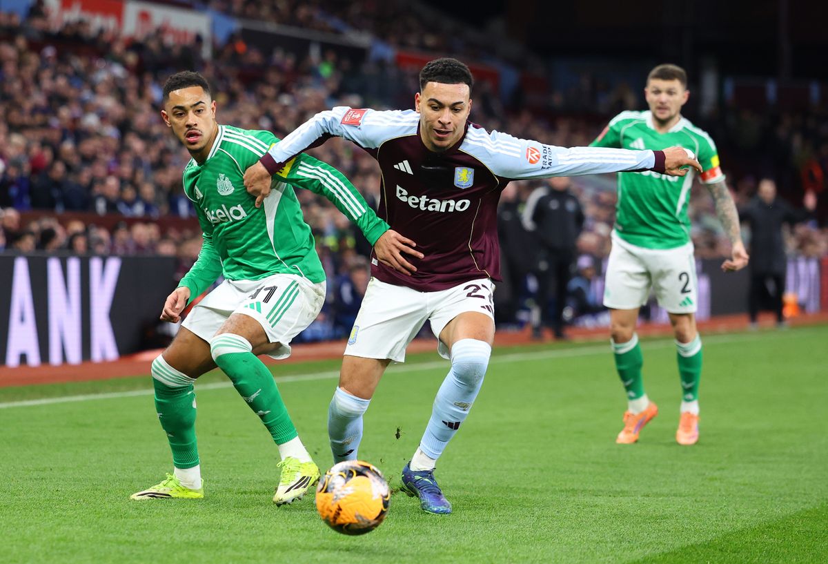 Morgan Rogers runs past Jacob Ramsey with the ball
