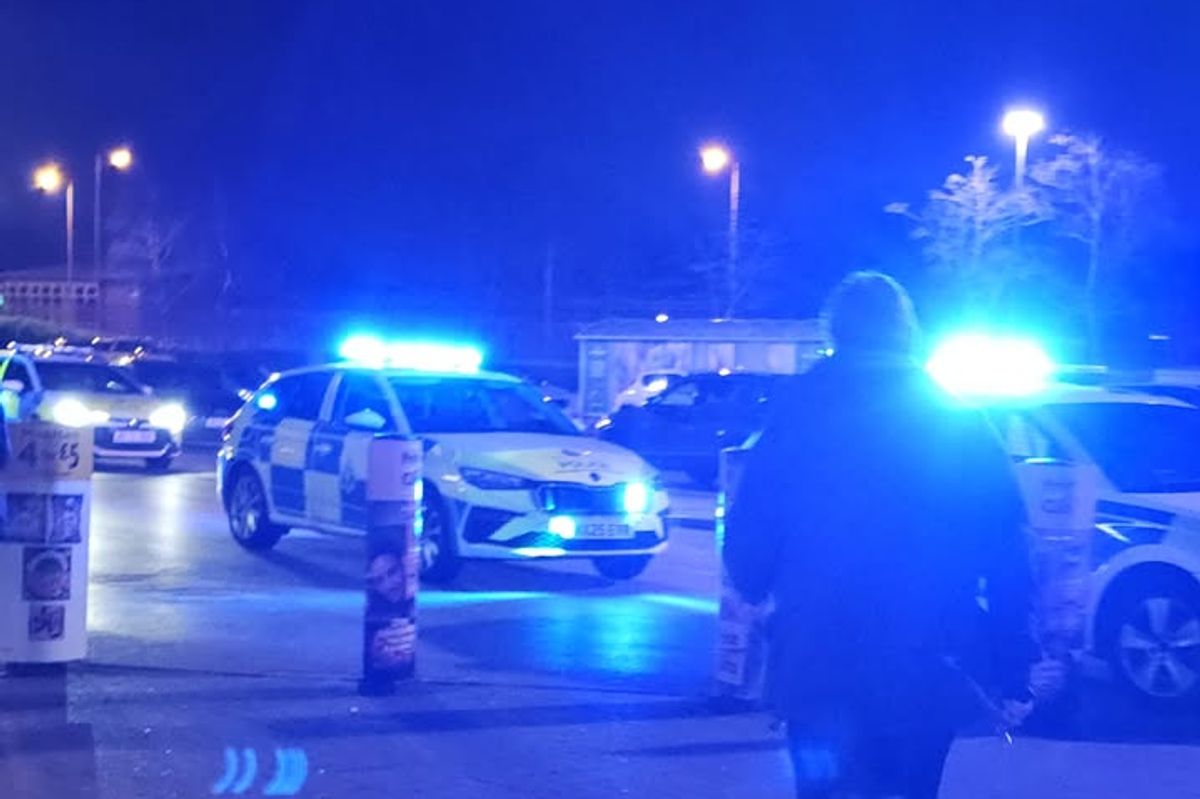 Police outside Morrisons on Besford Road, Belle Vale