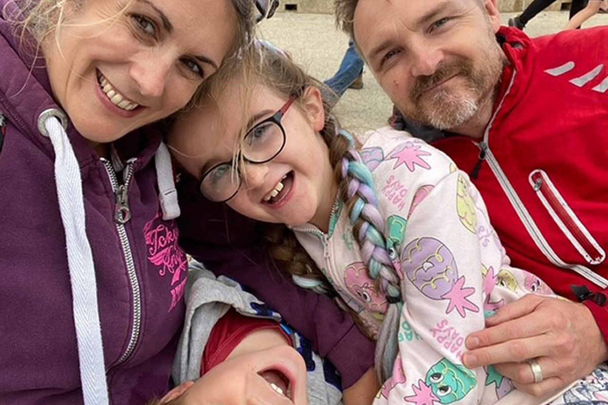 Sophia Chant, 11, (C) with her family at the beach