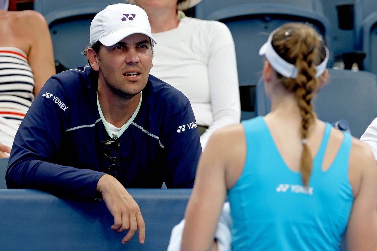 Elena Rybakina of Kazakhstan confers with Stefano Vukov