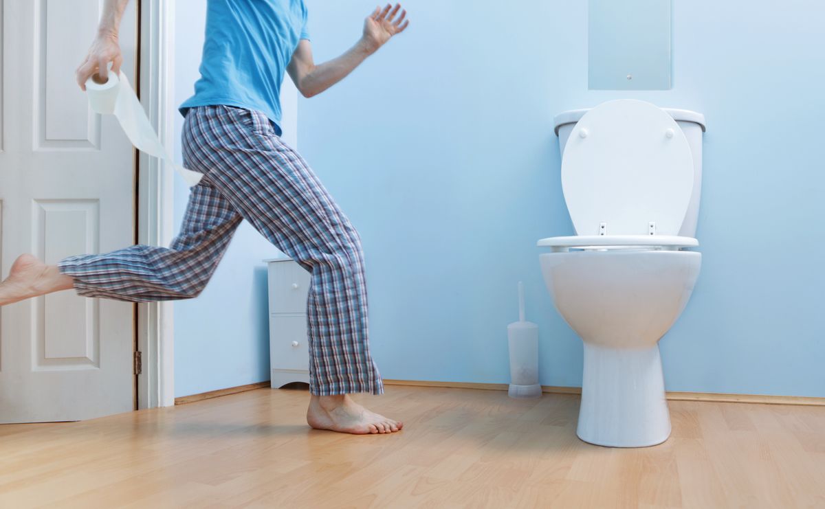 Man running to toilet