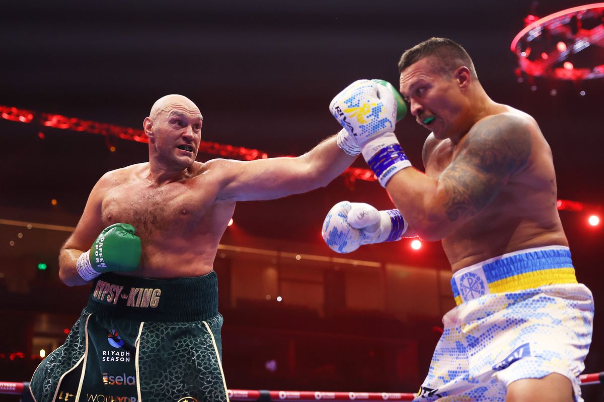 RIYADH, SAUDI ARABIA - MAY 18: Tyson Fury punches Oleksandr Usyk during the IBF, WBA, WBC, WBO and Undisputed Heavyweight titles' fight between Tyson Fury and Oleksandr Usyk at Kingdom Arena on May 18, 2024 in Riyadh, Saudi Arabia. (Photo by Richard Pelham/Getty Images)