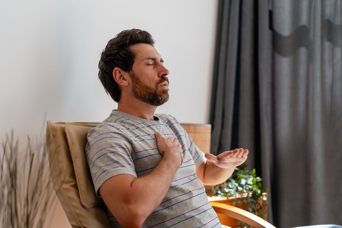 Man struggling to breathe