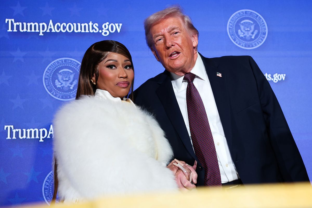 Musician Nicki Minaj (L) joins U.S. President Donald Trump on stage as he delivers remarks during the Treasury Department's Trump Accounts Summit at Andrew W. Mellon Auditorium on January 28, 2026 in Washington, DC