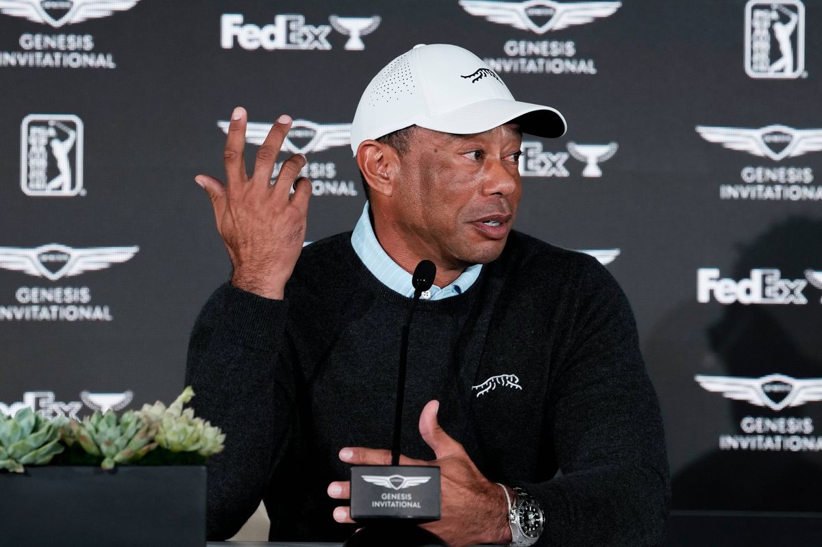 Tiger Woods speaks at a press conference