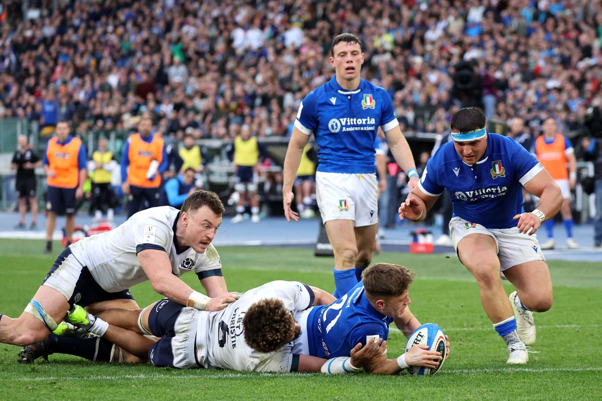 Stephen Varney of Italy scores his team's third try whilst under pressure from Andy Christie of Scotland during the Guinness Six Nations 2024 match between Italy and Scotland at Stadio Olimpico