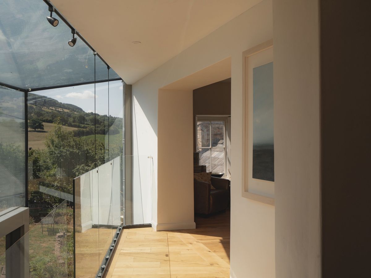 Glass connection between old and new parts of Alma House by Benham Architects, one of the six projects shortlisted for RSAW Welsh Architecture Awards 2026 
