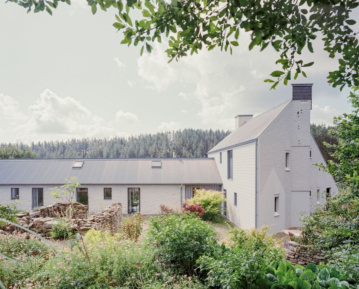 Rear and side view of a new home built on site of old farmhouse but with period character included as one of Six projects shortlisted for RSAW Welsh Architecture Awards 2026 - this is Pantybara by Rural Office