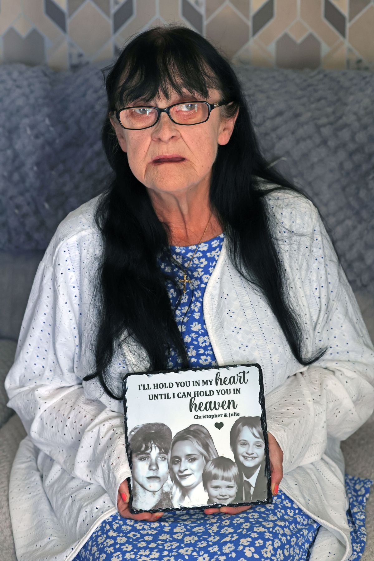 Jean Hartley with a memorial to her dead children