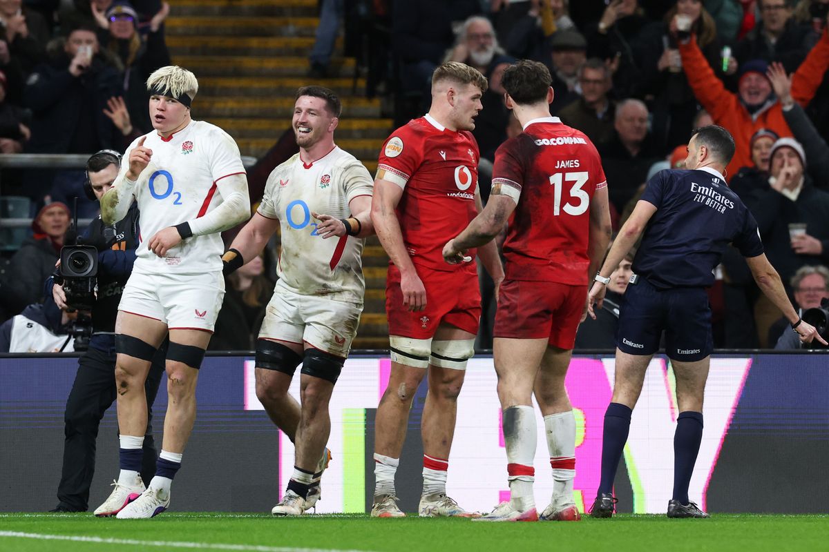 Henry Pollock of England celebrates scoring a try, which is later awarded as a penalty try
