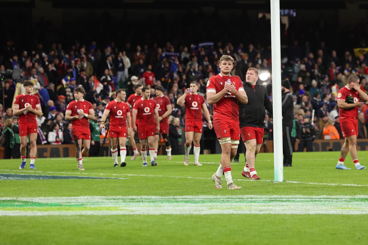 Wales applaud their fans at the final whistle after another difficult afternoon
