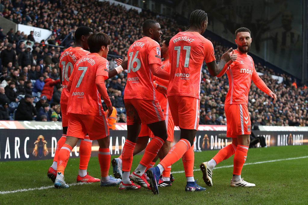 Coventry City's Ephron Mason-Clark (hidden) celebrates scoring their side's first goal of the game with team-mates during the Sky Bet Championship match at The Hawthorns