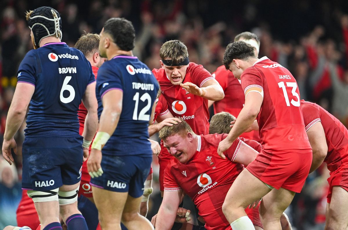 Wales' Rhys Carre celebrates with Eddie James and Alex Mann