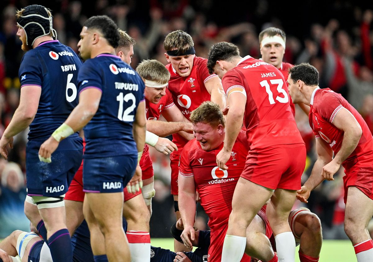 Wales' Rhys Carre celebrates with Eddie James and Alex Mann
