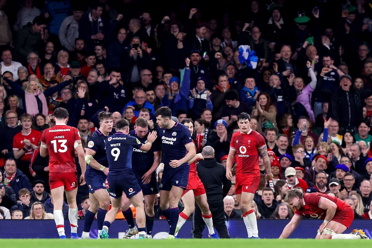 Scotland's Finn Russell celebrates with teammates after scoring