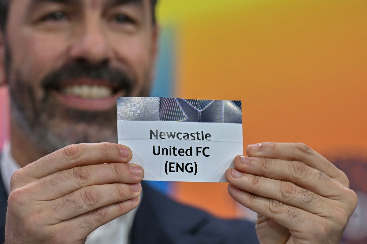 UEFA Champions League ambassador Robert Pires holds up the slip of Newcastle United