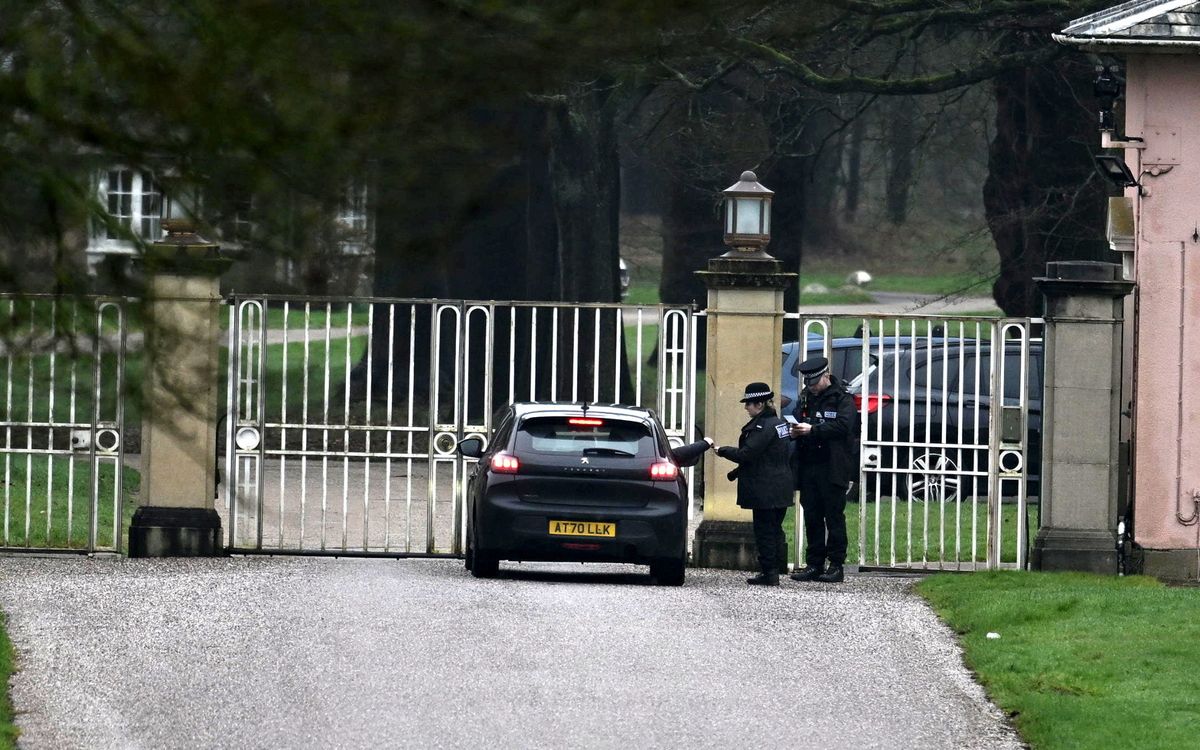 Police officers are seen at the gates of former Prince Andrew's home in Windsor as Thames Valley Police confirm they are investigating a man in relation the offence of misconduct in public office. 
Photo released 19/02/2026