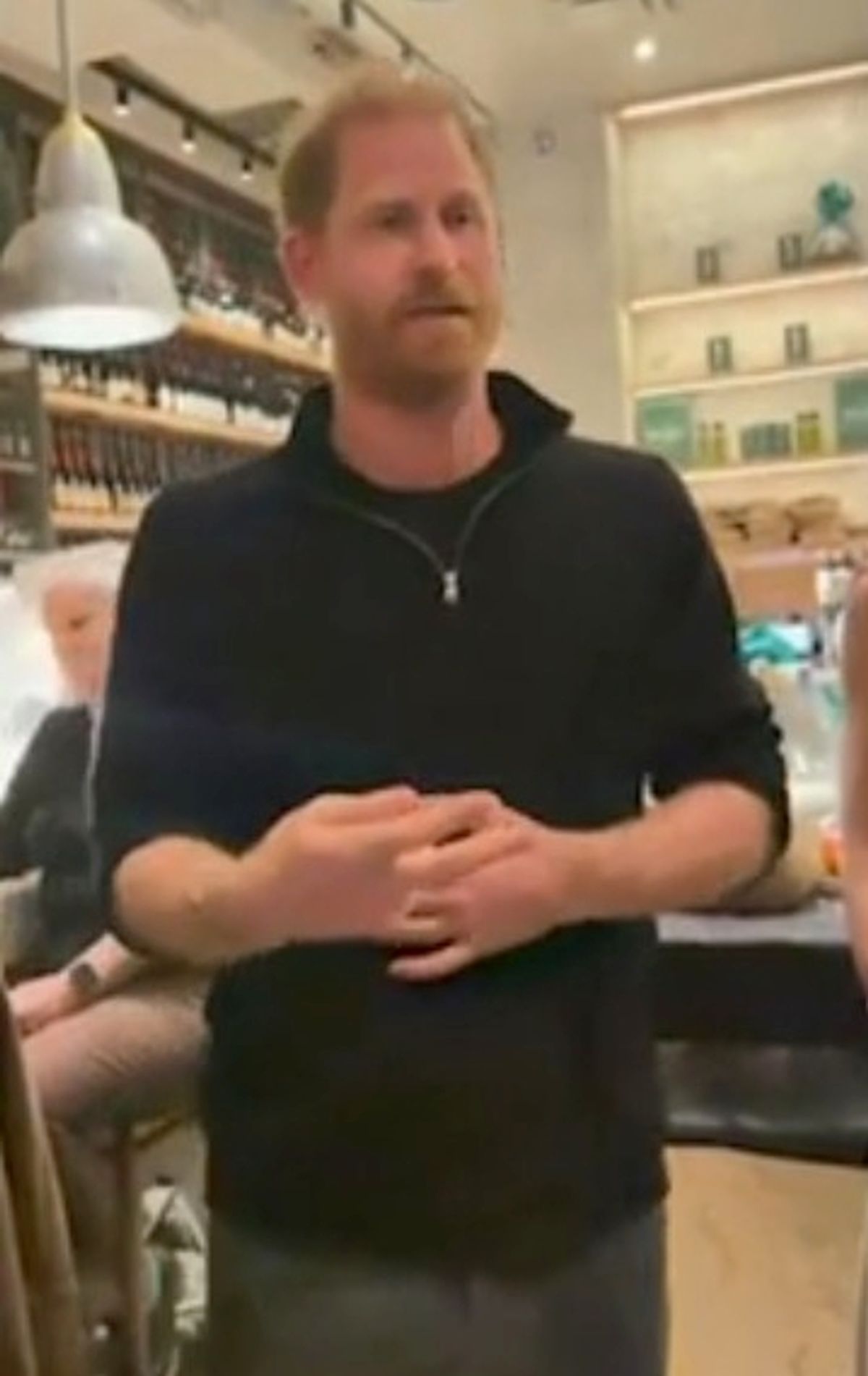 Prince Harry talks to bereaved families in Los Angeles