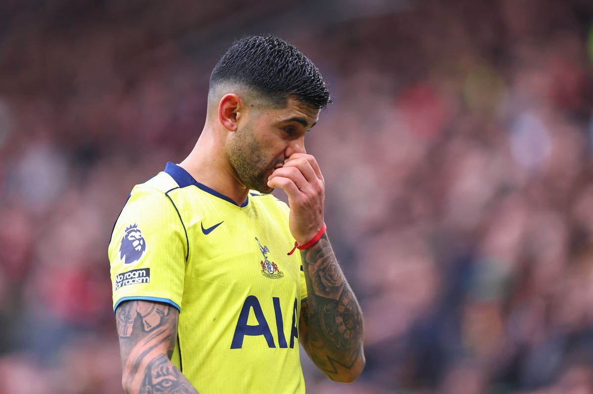 Cristian Romero of Tottenham Hotspur reacts as he walks off after being sent off during the Premier League match between Manchester United and Tottenham Hotspur