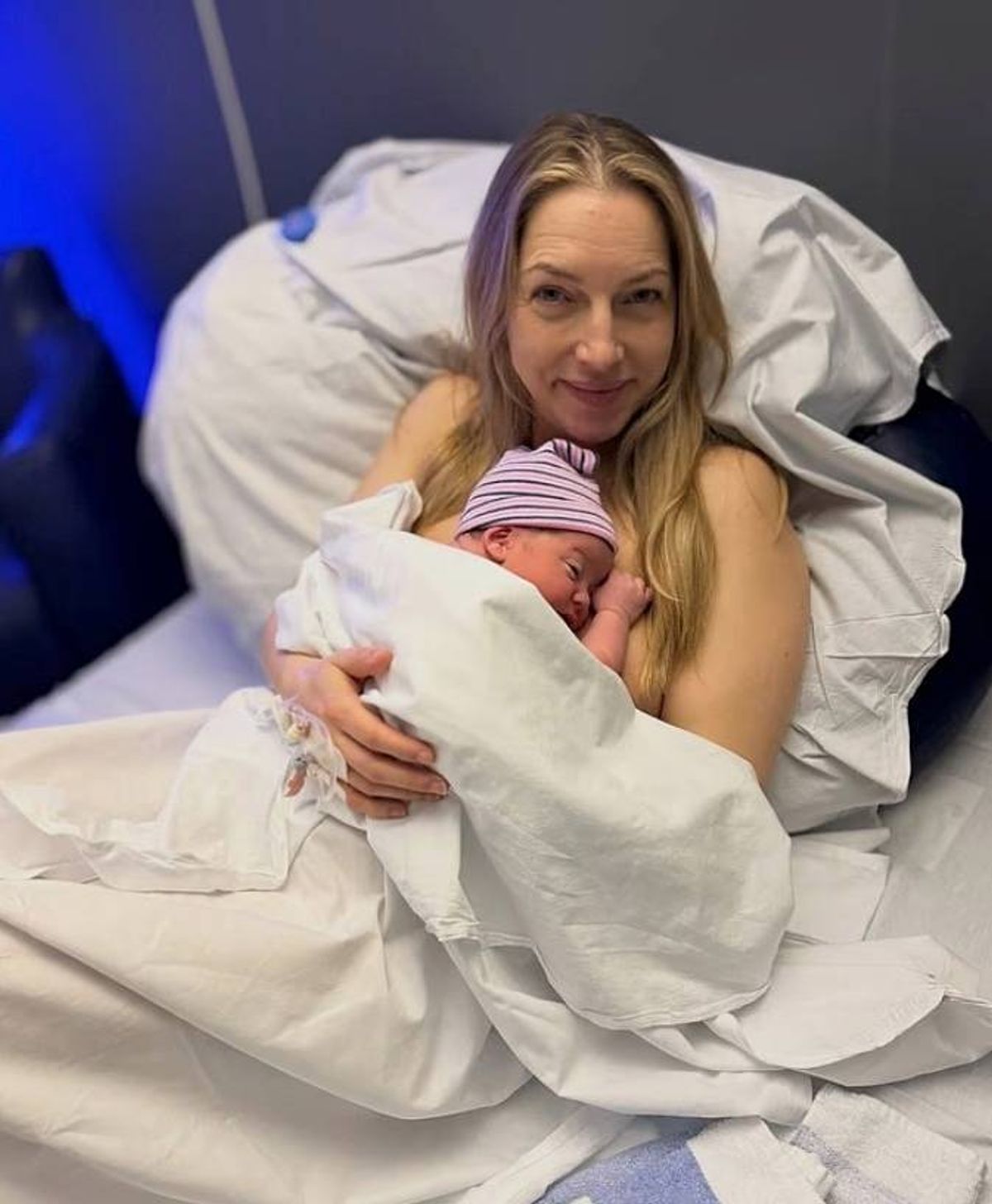 Emma cradled her little one