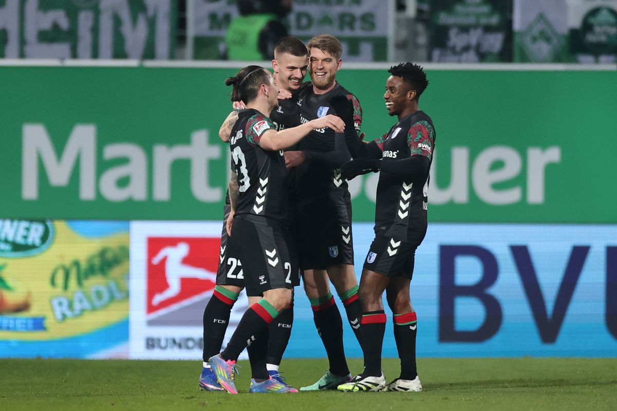 Mateusz Zukowski celebrates with his teammates