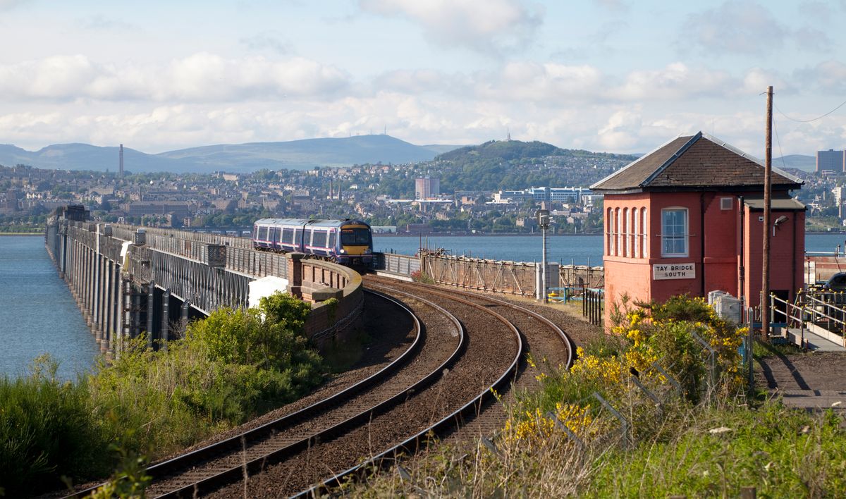 The railway bridge over the River Tay with the city of Dundee in the background
