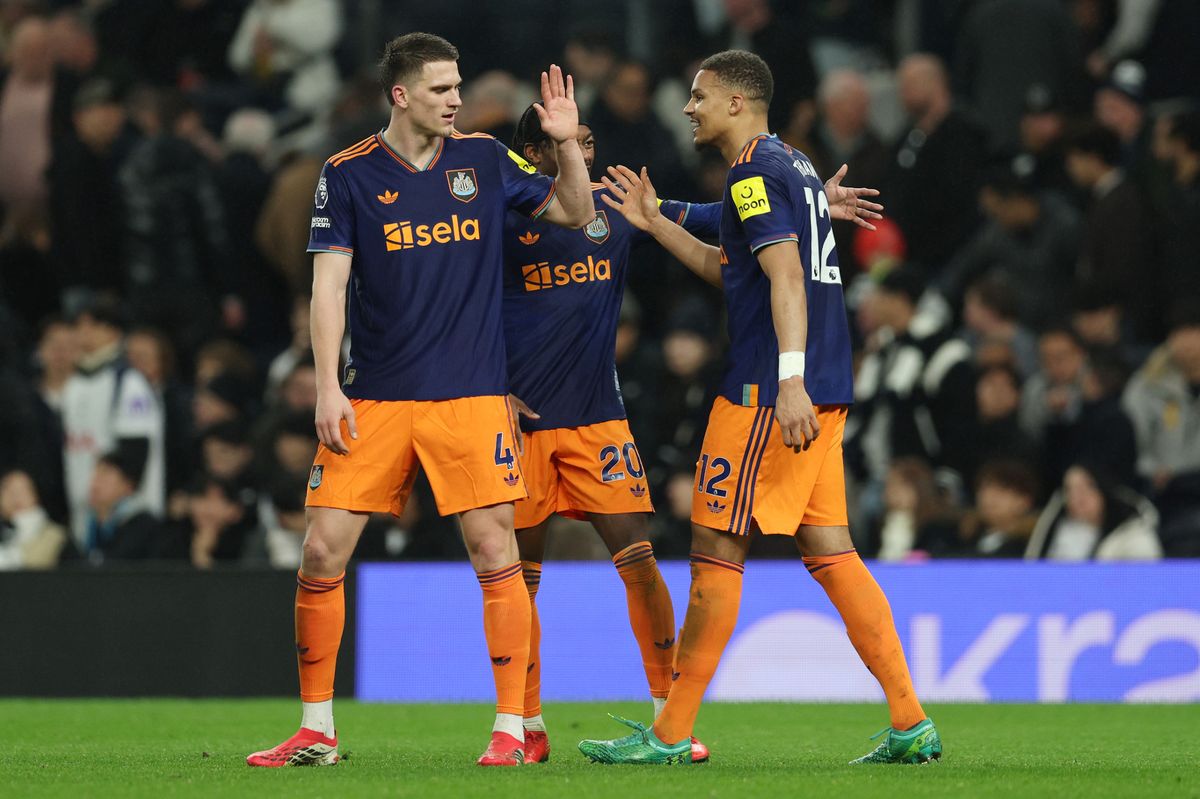 Malick Thiaw of Newcastle United celebrates scoring with Sven Botman and Anthony Elanga