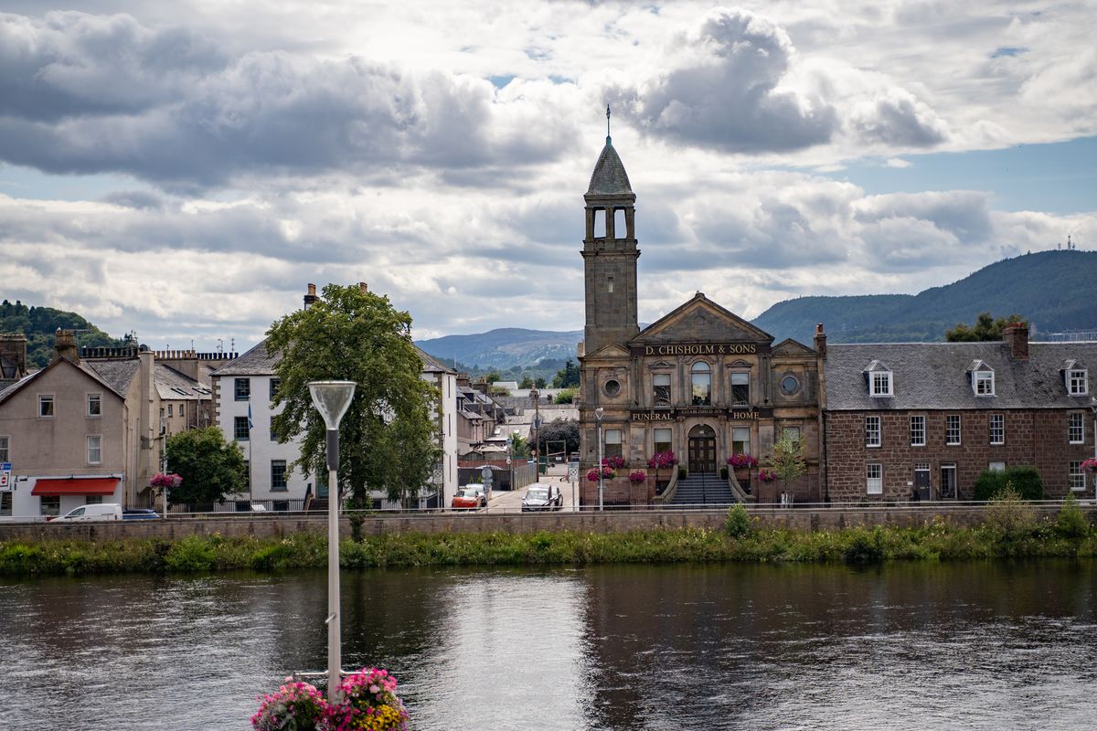 View of Inverness city and Ness river from an old cemetery - stock photo