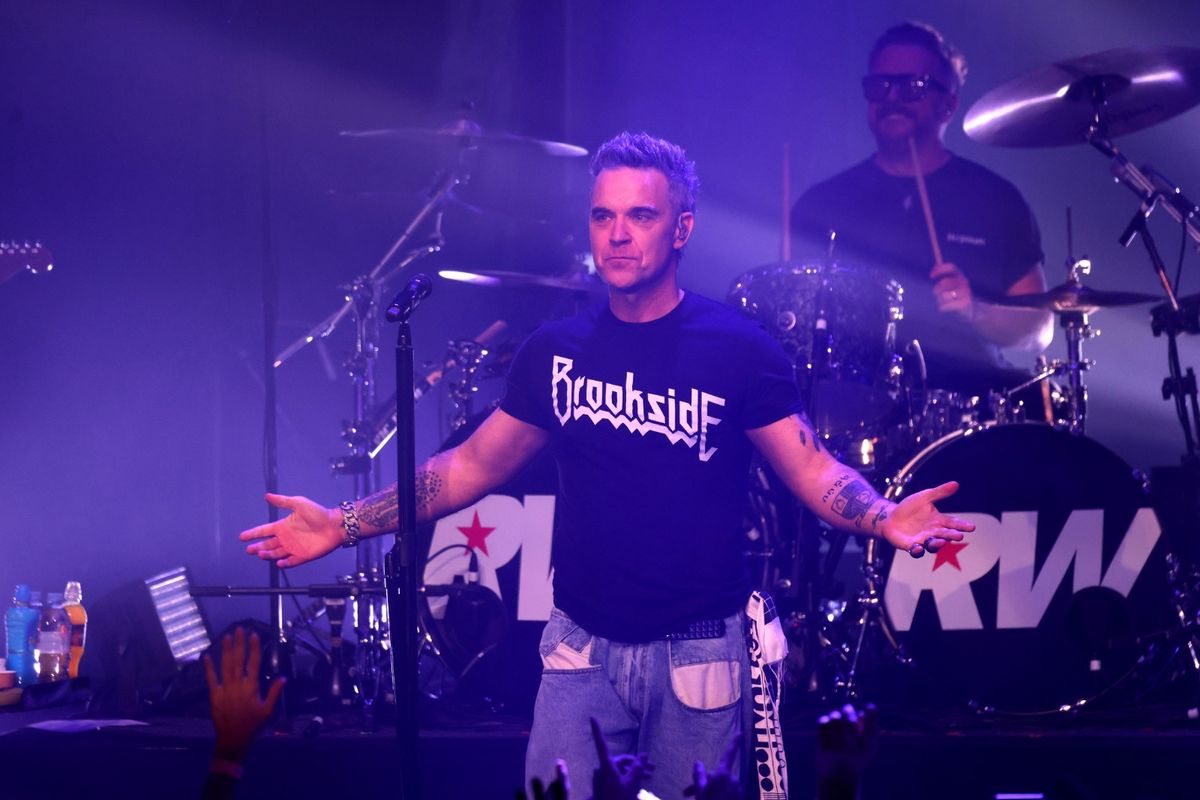 Robbie Williams on stage at the Liverpool Olympia