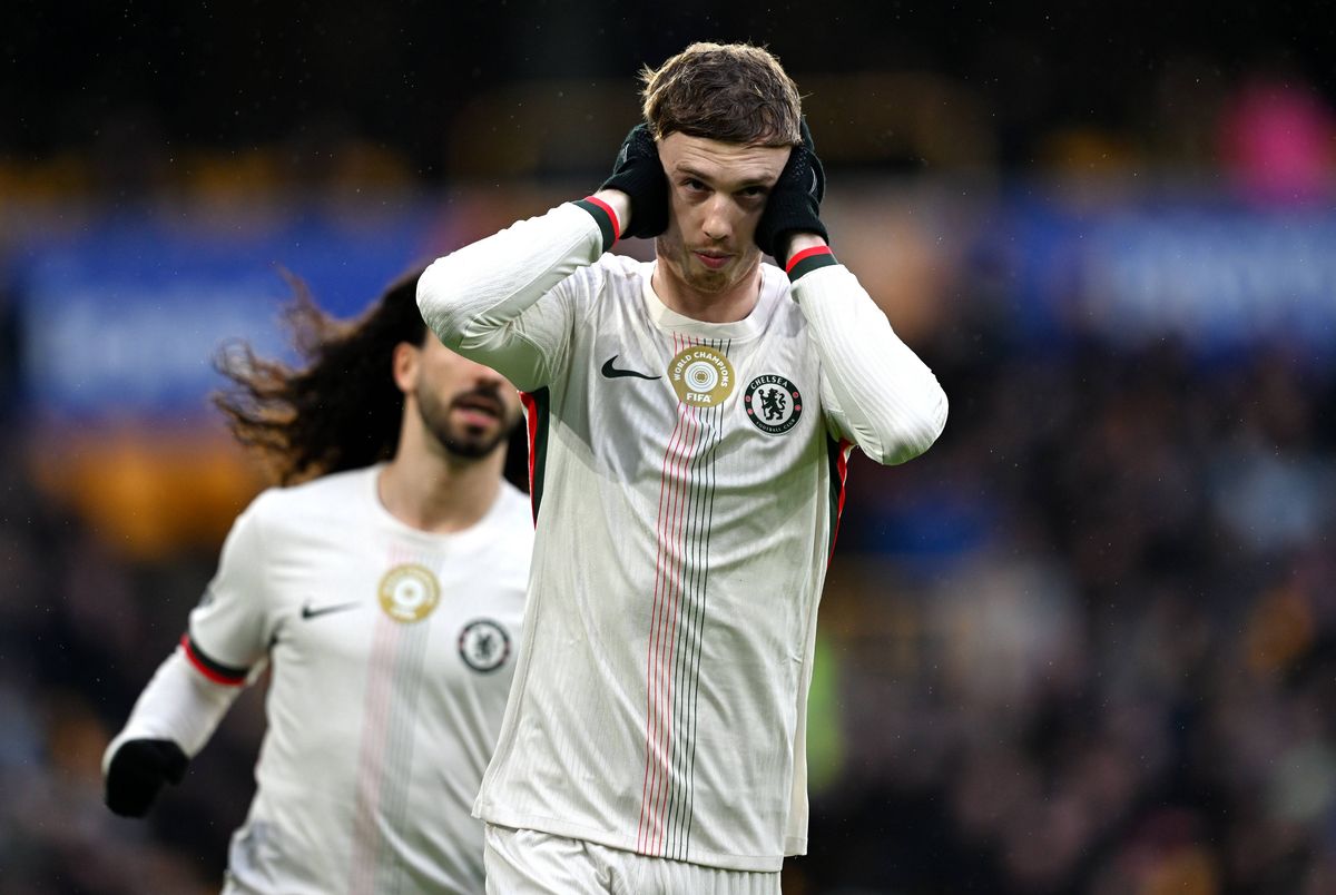 Cole Palmer celebrates scoring his team's first goal from the penalty spot during the Premier League match between Wolverhampton Wanderers and Chelsea at Molineux. 