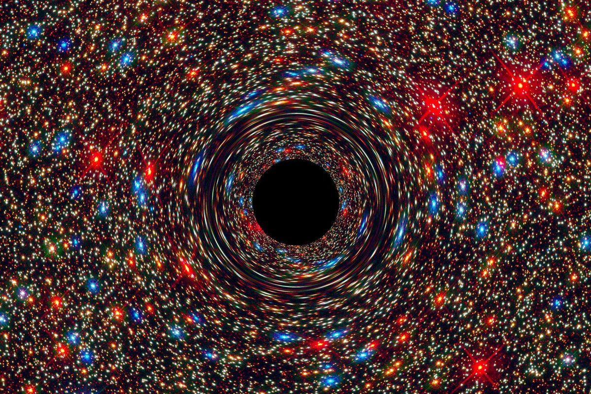 This computer-simulated image shows a supermassive black hole at the core of a galaxy.