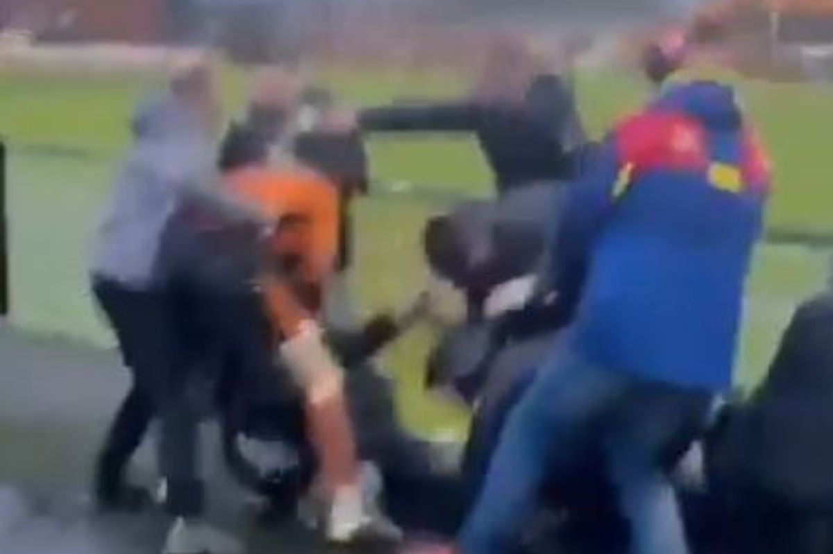 At least one player was seen brawling with supporters during the FA Vase match between Bilston Town and Droylsden