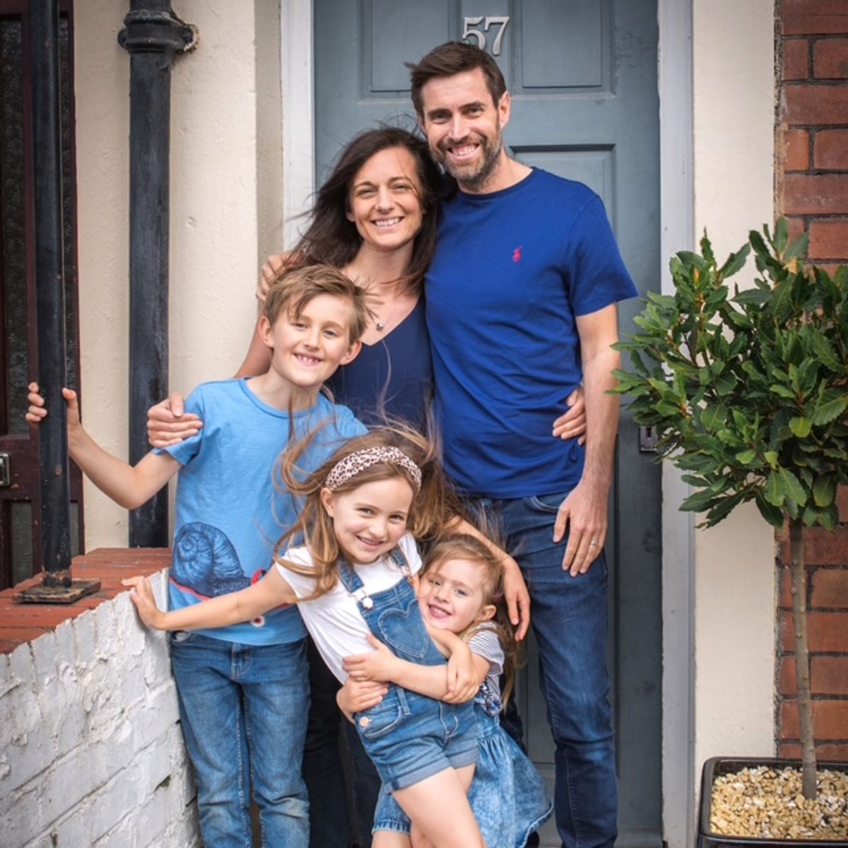 Louisa, Rich and their children outside their home, 2020 (Cover Images)