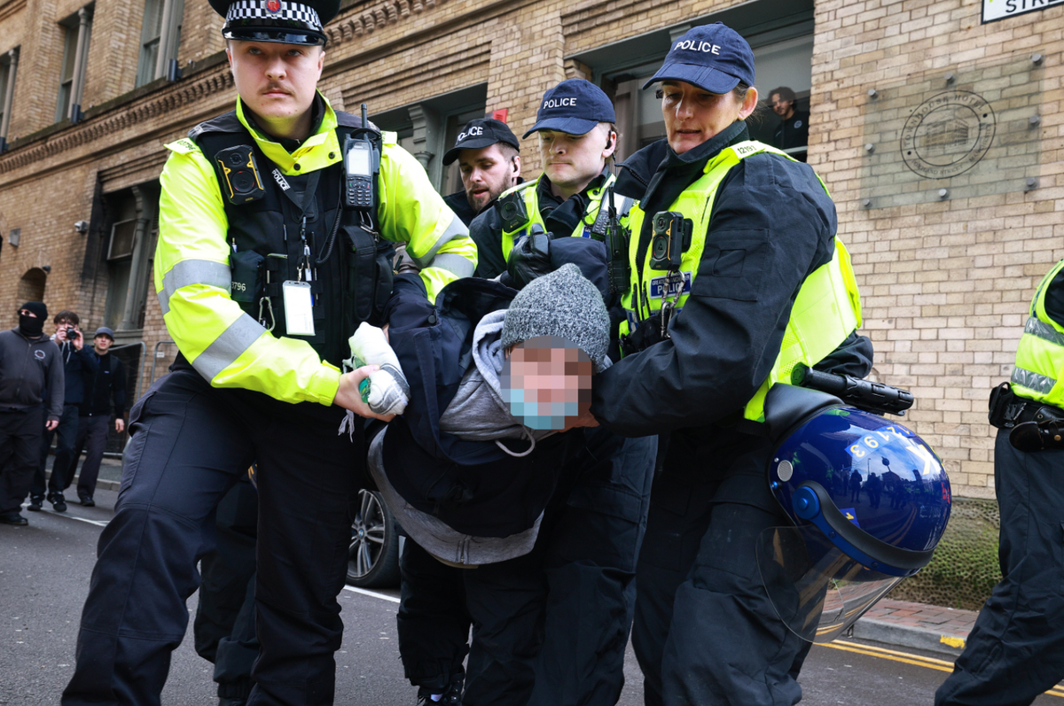 Protesters clash with police in Manchester city centre