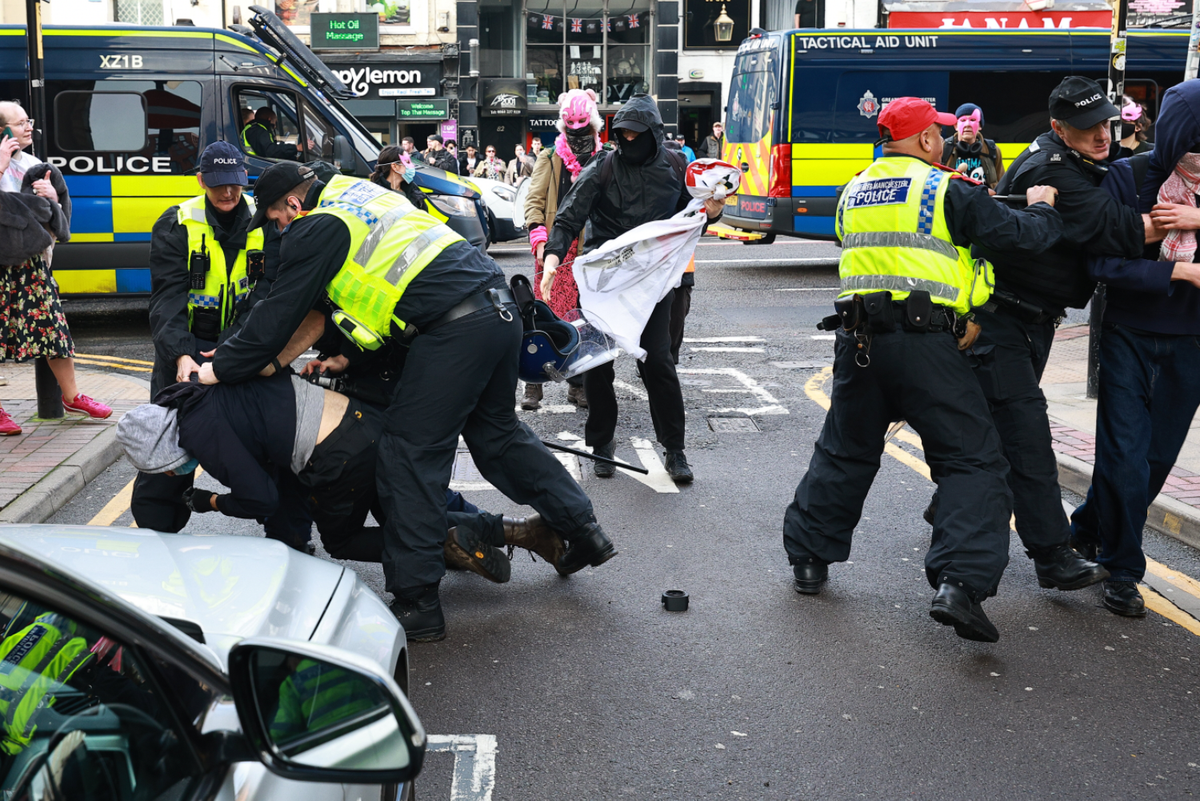 Protesters clash with police in Manchester city centre