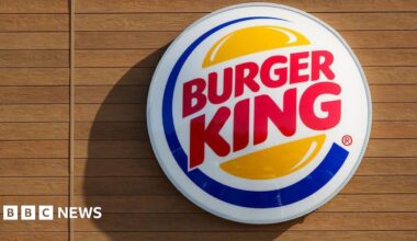 A Burger King logo is displayed on a sign at a restaurant on December 12, 2025 in San Diego, CA.