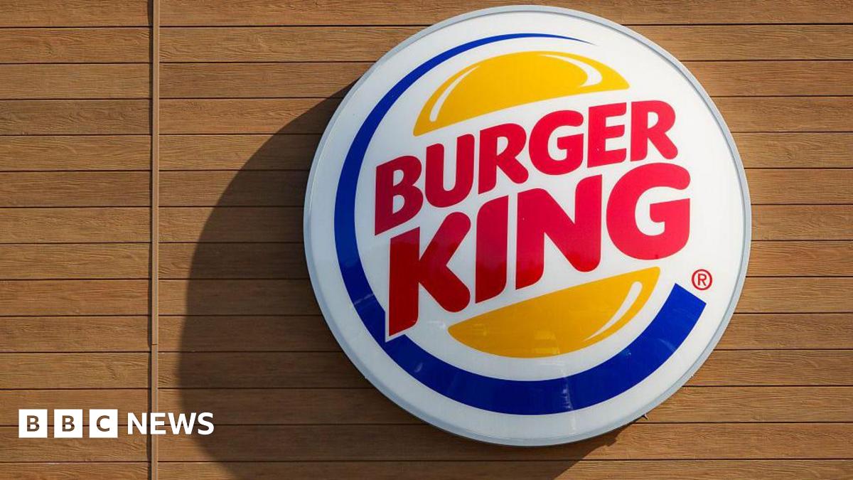 A Burger King logo is displayed on a sign at a restaurant on December 12, 2025 in San Diego, CA.